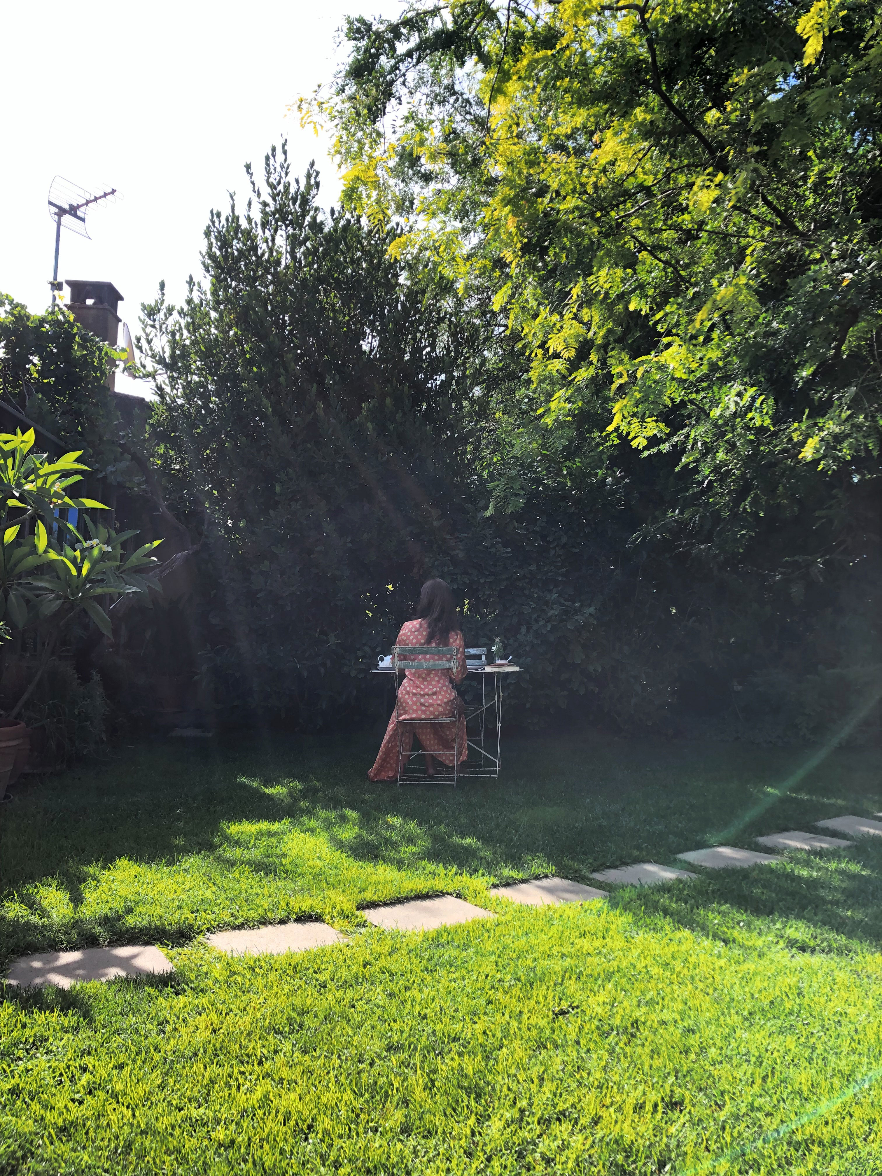 Girl having breakfast in the garden